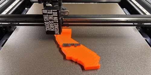 Photo of a 3D printer printing the state of california with the EFF logo